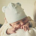 woman carrying baby